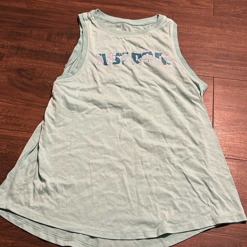 Nike blue tank top
Has a couple small stains